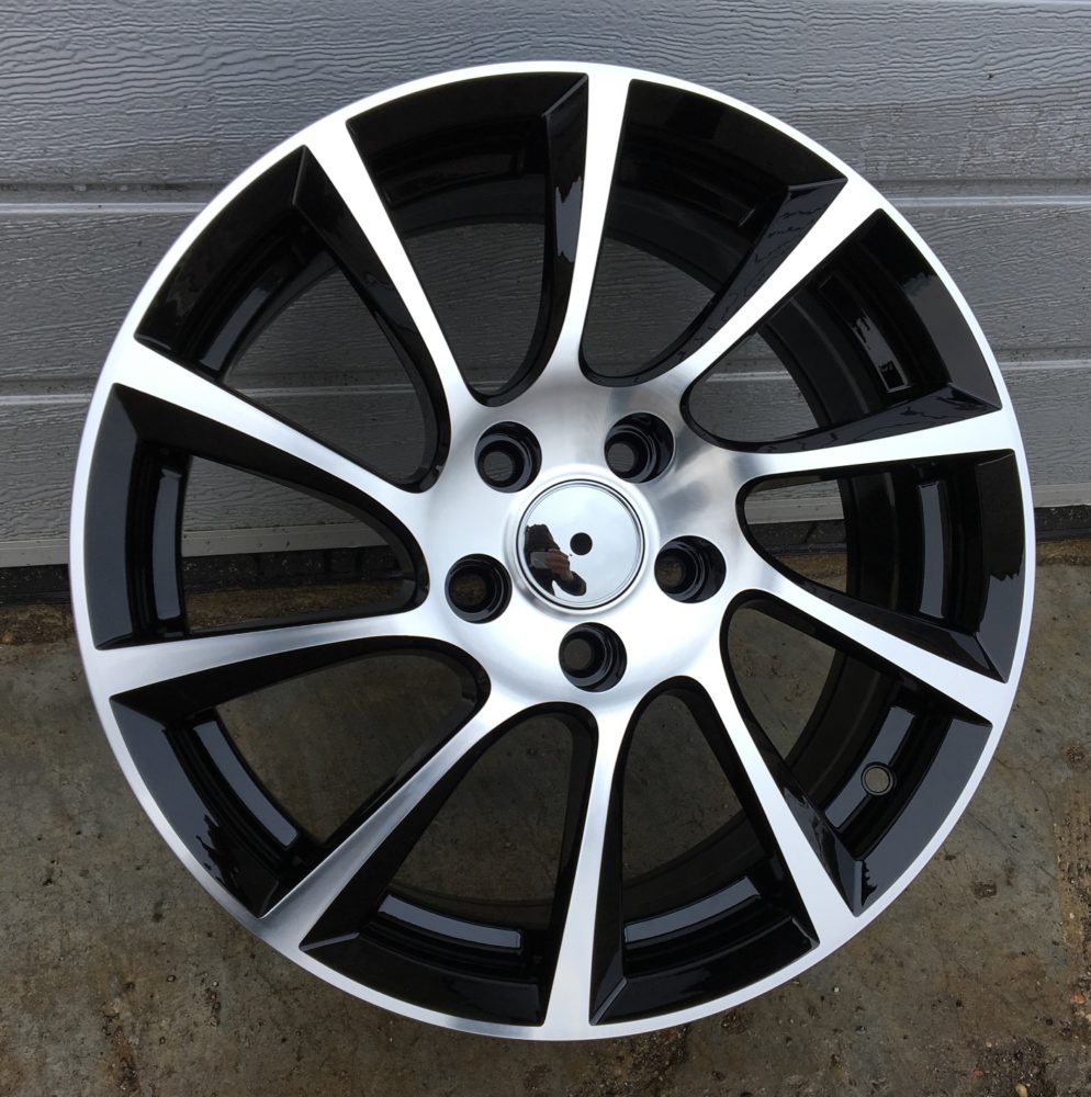 Opel OP501  Melns ar pulētu virsmu R15 4X100 6.5J et39 56.6